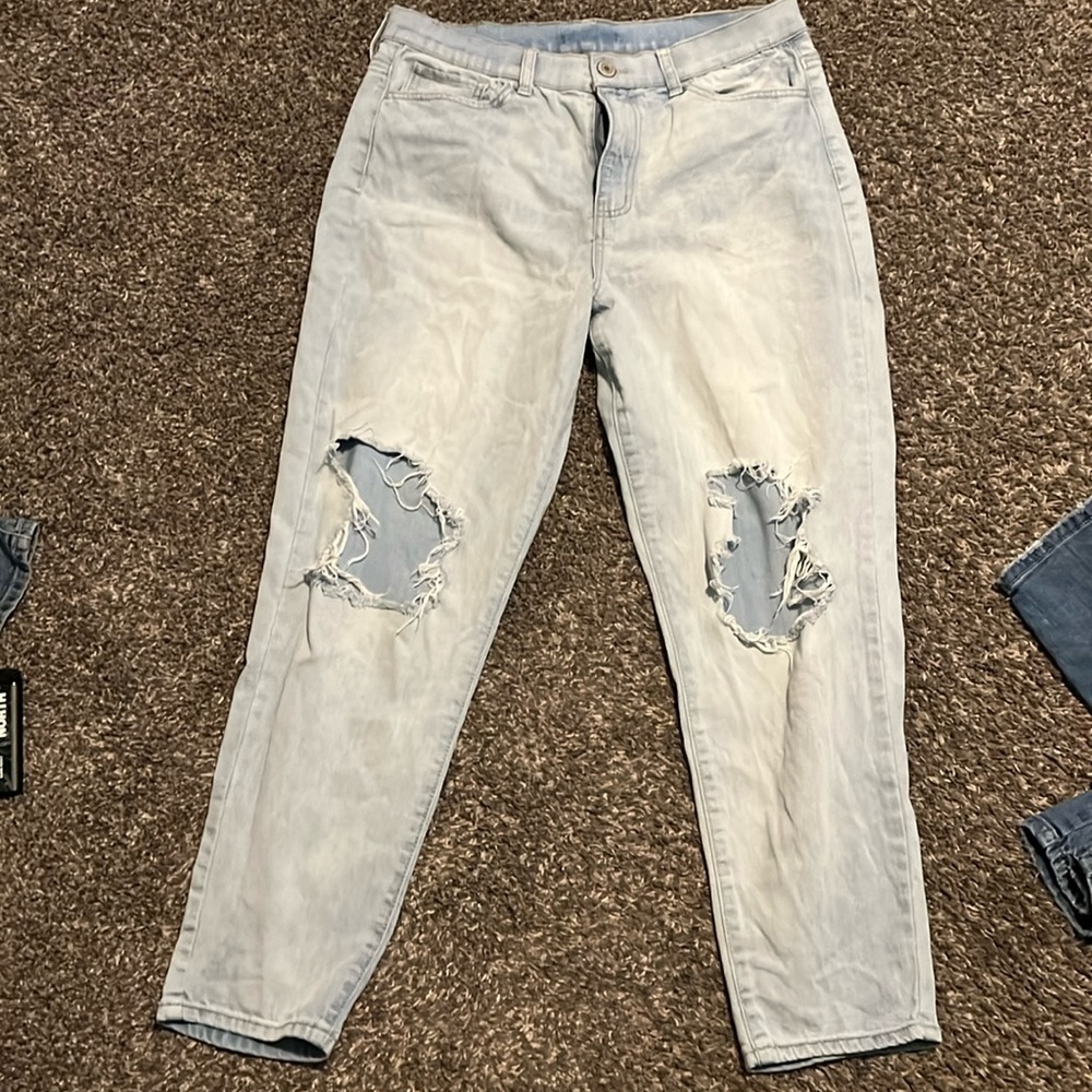 High-rise baggy jeans with rips in the knees